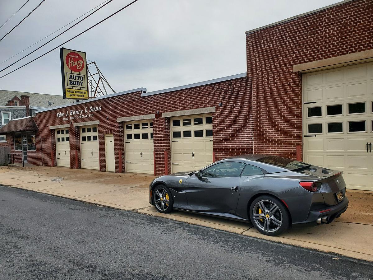 Edward J. Henry’s storefront with a Ferrari outside.